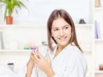 Woman In Bathrobe Relaxing At Home Stock Photo