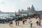 Gondolas Moored At The Entrance To The Grand Canal Stock Photo