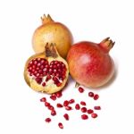 Whole And Halved Pomegranate Stock Photo