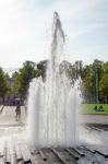 People Relaxing Next To The Fountain At The Cathedral In Berlin Stock Photo