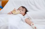 Little Asian Girl Lying  On A Medical Bed Stock Photo