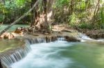 The Water Flowing Over Rocks And Trees Down A Waterfall At Huay Mae Khamin Waterfall National Park ,kanchana Buri In Thailand Stock Photo