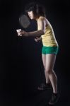 Asian Woman Playing Badminton Stock Photo