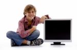 Front View Of Sitting Boy With Lcd Screen Stock Photo