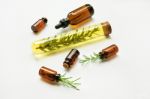 Glass Bottle Of Essential Oil  With Rosemary Stock Photo