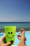 Man With A Drink Over The Sea Stock Photo