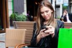 Female Shopper Texting Stock Photo