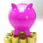 Piggybank On Coins Showing Britain Investments Stock Photo