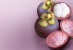 Mangosteen On Purple Solid Background Stock Photo