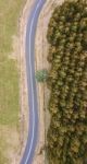 Road And Field In The Tasmanian Countryside Stock Photo