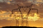 Electric Pylon At Sunset Stock Photo