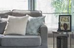 Pillows On Modern Grey Sofa In Living Room Stock Photo