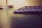 Keyboard Sitting On A Cutting Matt With Light In The Background Stock Photo