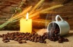 Roasted Coffee Beans And Candle Light Stock Photo