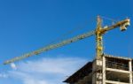 Tower Crane And Skyscraper On Blue Sky Background Stock Photo