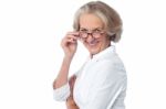 Attractive Aged Woman Looking At You Stock Photo