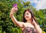 Young Girl Making Selfie In A Park Stock Photo