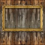 Retro Big Old Gold Picture Frame On Wood Wall Stock Photo