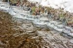 Ice On The Bank Of The Creek Stock Photo