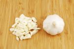 Garlic Preparation Ways On A Cutting Board Stock Photo