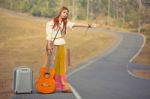 Hippie Girl Hitchhiking Stock Photo