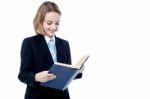 Small School Girl Reading A Book Stock Photo