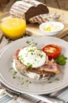 Poached Egg And Bacon On Rye Bread, Healthy Breakfast Stock Photo