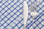 Cutlery On Napkin Stock Photo