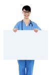 Medical Practitioner Holding Blank Ad Board Stock Photo