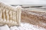 Ice Covered Staircase On The Beach Stock Photo