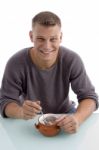 Smiling Man Eating Cornflakes Stock Photo