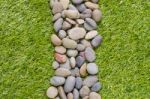 Stone On Grass Background Stock Photo