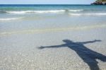 Shadow Man On Beach Stock Photo