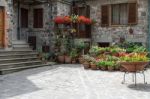 Multitude Of Flowers On Display Outside A House In Radicofani Stock Photo