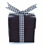 Black Gift Box With Checkered Ribbon Stock Photo