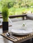 Clean Dishes On Wooden Table On Green Background Stock Photo