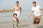 Family  In The Beach Stock Photo