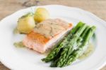 Grilled Salmon With Boiled Potatoes And Asparagus On White Plate Stock Photo