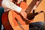 Young Girl Plays Guitar Stock Photo