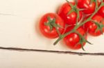 Fresh Cherry Tomatoes On A Cluster Stock Photo