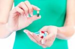 Capsules In Woman's Hand Stock Photo