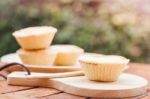 Mini Pies On Wooden Plate Stock Photo