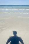 Shadow Man On Beach Stock Photo