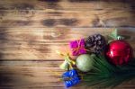 Christmas Background With Christmas Gift,red Balls, Pine Cones On Wooden Background. Christmas Vintage Style Stock Photo