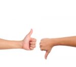 Thumb Up And Thumb Down Hand Signs Stock Photo