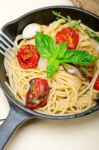 Spaghetti Pasta With Baked Cherry Tomatoes And Basil Stock Photo