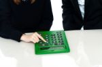 Cropped Image Of Teacher And A Student Operating Calculator Stock Photo