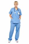 Cheerful Relaxed Female Doctor In Uniform Stock Photo