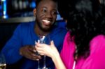 Affectionate Romantic Couple In A Bar Stock Photo