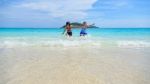 Mother And Daughter Happy On The Beach Stock Photo